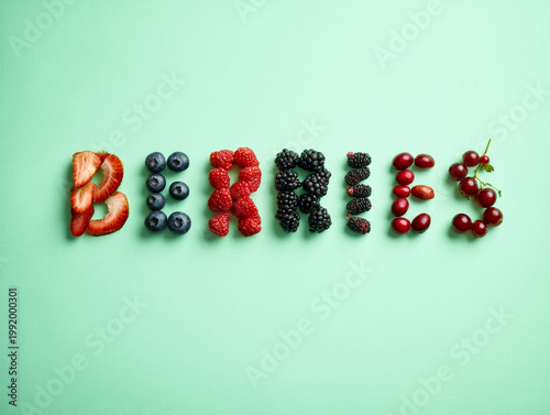 the word BERRIES from ingredients strawberries, blueberries, raspberries, blackberries, and cranberries. Others include mulberries, acai, goji berries, currants, and lingonberries on a mint background