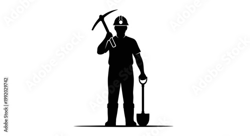 Man wearing hard hat holding pickaxe.