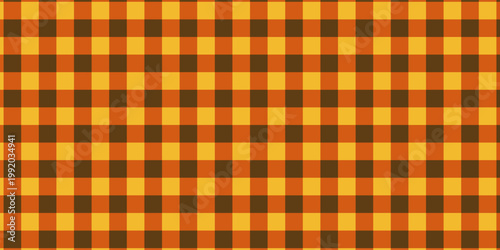 Checkered autumn picnic plaid texture. Gingham or vichy pattern. Thanksgiving Day or Halloween print. Tablecloth, blanket, napkin or towel textile design. Vectorillustration.