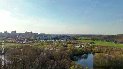 Aerial panorama of Prague outskirts with parks and lakes in spring