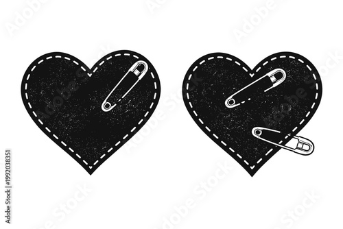 Set of two distressed black heart patches with white dashed stitching and metallic safety pins. Gritty punk rock style graphic elements for subculture fashion and alternative design.