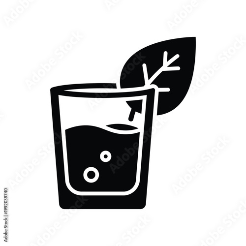 Solid black silhouette icon of a glass of water with a large leaf representing natural refreshment and healthy hydration lifestyle