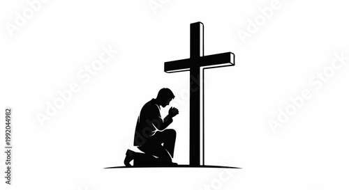 Silhouette of a person kneeling and praying before a large cross