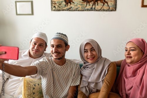 Tablou pe pânză Family capturing joyful selfie moment