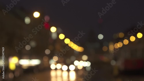 Blurred evening city lights on a Prague street with bokeh effect. urban atmosphere at night.