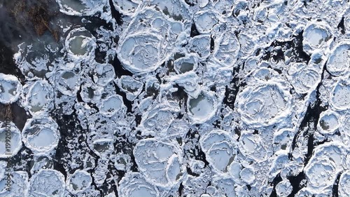 Aerial top view of ice-covered Warta River in Gorzów Wielkopolski, Poland