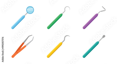 An assortment of colorful dental tools laid out on a white background