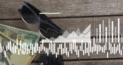 Fototapeta Displaying dark-framed sunglasses lying diagonally on wooden plank, with cash, car key and charts