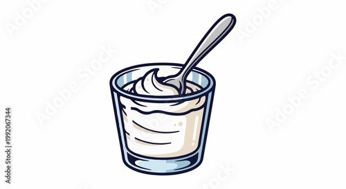 A glass cup filled with creamy white yogurt and a metal spoon