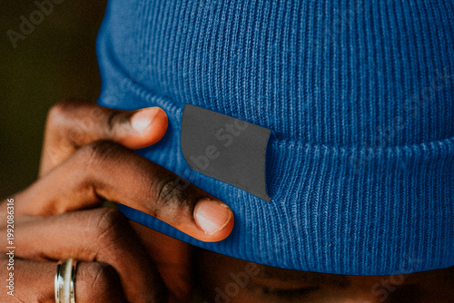 Bilde på lerret Blue beanie with hand detail, blank clothing suitable as mockup