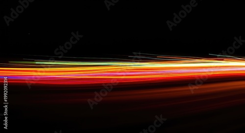 Dynamic, vibrant streaks of captured residual light creating a flowing, ethereal abstraction across a dark field. Motion blur technology, reflection, modern, design