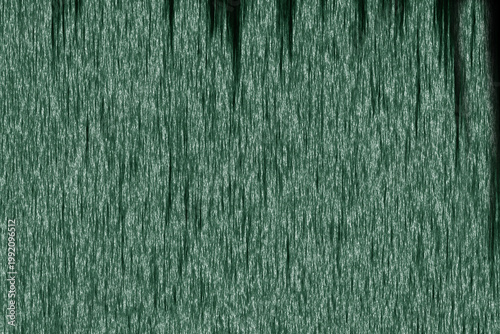 Greenish streaks cascade vertically across the frame