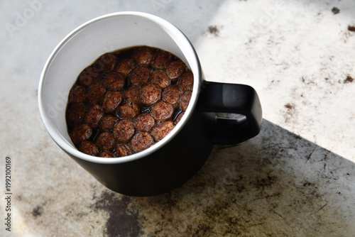 Coffee with chocolate chips on the table