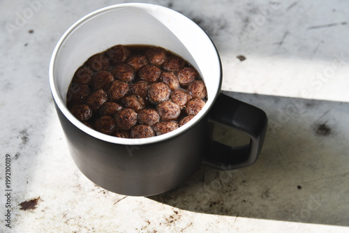 Coffee with chocolate chips on the table