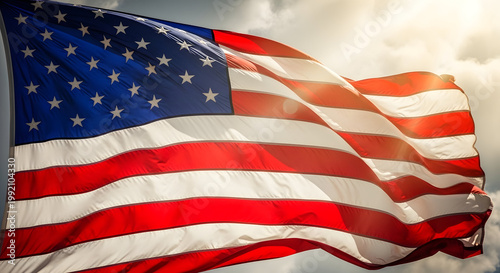 The American flag waving in the wind on a cloudy day on transparent background