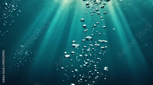 Underwater scene bubbles ascending with sunlight rays streaming down