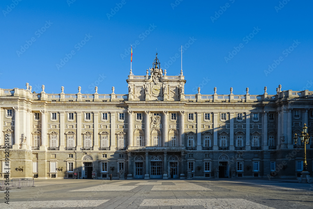 Obraz premium Spain,Royal Palace of Madrid, a grand neoclassical building with ornate fa?ade and clear blue sky