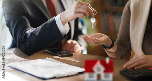 Bild auf Leinwand Real Estate Agent Handing Over House Keys to New Homeowner, Successful Property