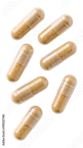 Bild auf Leinwand Transparent capsules with herbal powder falling isolated on transparent backgrou