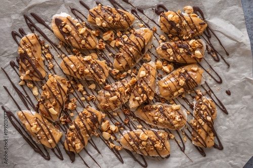Viral date bark snack with peanut butter and chocolate drizzle on parchment paper