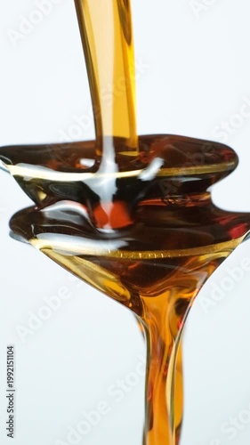 Creative conceptual shot of maple syrup and spoons