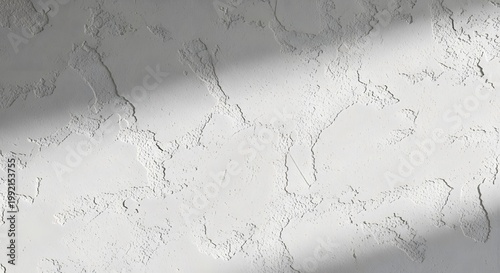 Textured White Wall with Diagonal Sunlight Shadows