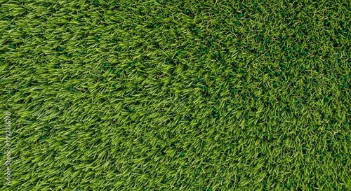 Close-up of vibrant green artificial turf background