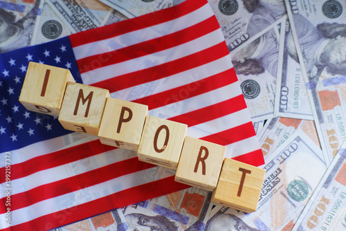 The IMPORT text with the US flag and dollar as the background. The concept of increasing import taxes and fees set by the US government
