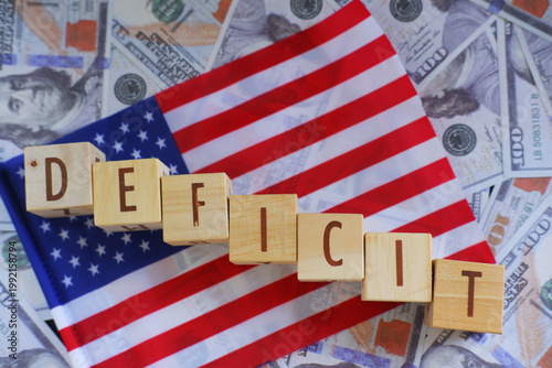 The US Budget Deficit is displayed using text and the US flag. The text DEFICIT is displayed with the US flag and US dollar in the background.
