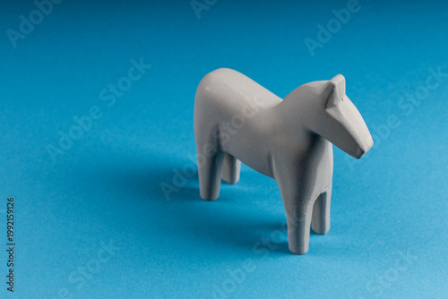 wooden horse on a blue background, top view