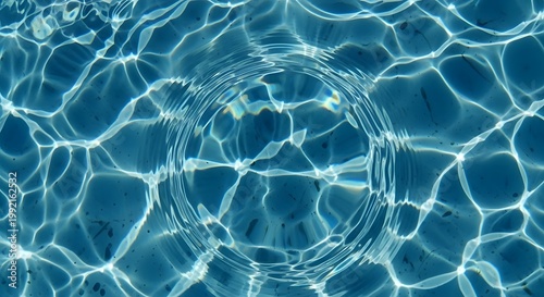 rippling blue water surface with light reflections