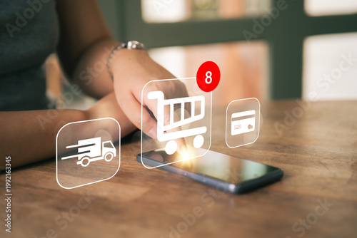 Women shop online through applications. Ordering online via mobile phones. The convenience of modern shopping.