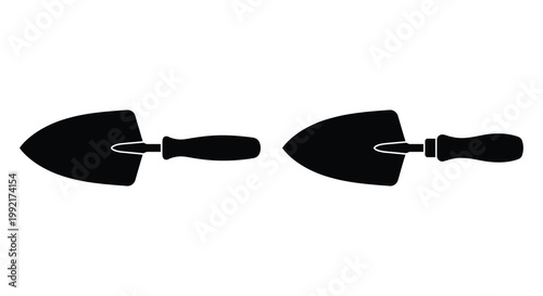 Two gardening trowels displayed in a stark black silhouette