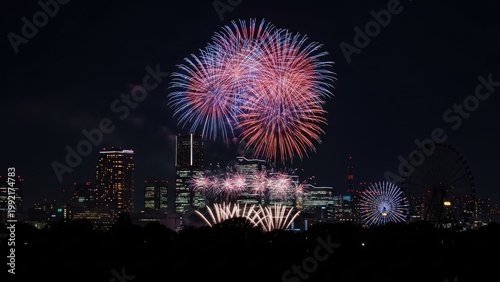 Colorful fireworks explode over city skyline at night celebration event