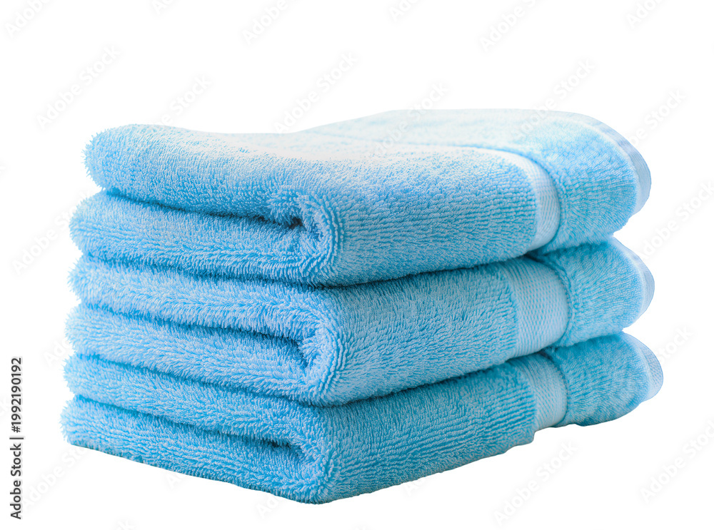 Φωτογραφία Isolated stack of three folded soft fluffy light blue bath towels for spa bathro