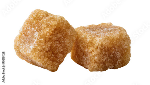 Canvas Print Isolated two brown sugar cubes close-up, unrefined raw cane sugar for sweetening