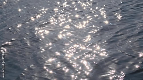 Wave Sunlight Reflection Water Ripple Shimmer on Blue Ocean Surface with Sparkling Glare Texture