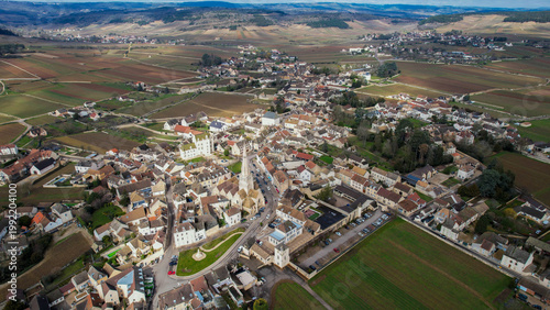 Tableau sur toile Aerial of the village Meursault in France on a cloudy afternoon in late winter