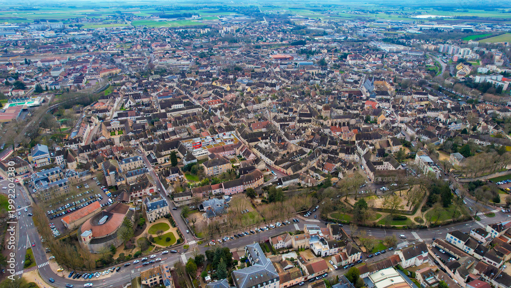 Obraz premium Aerial of the old town of Beaune in France on a cloudy morning in early spring.