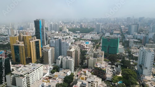 Captivating aerial view of San Isidro, Peru. Unveils a bustling cityscape, showcasing a stunning array of towering skyscrapers, each a testament to innovation and architectural excellence.