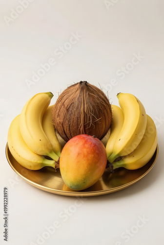 Isolated on a white background, this fresh and organic snack of yellow bananas and a red apple offers a juicy, healthy nutrition boost for a sweet vegetarian diet