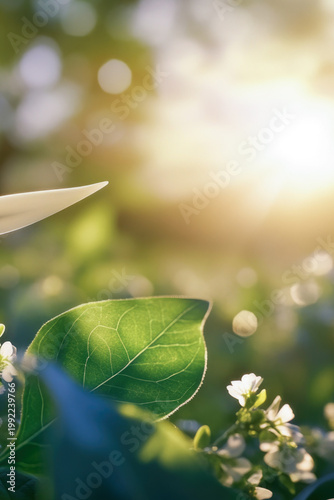 A wind turbine standing alone in a green field with a blue sky vertical frame