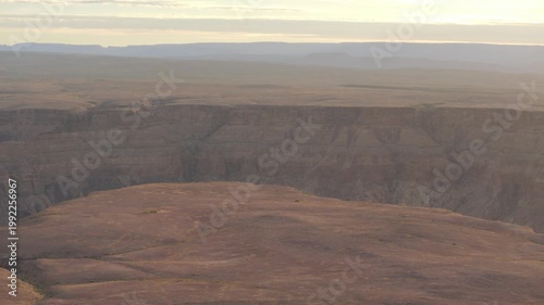 Rugged cliffs line the edges of Fish River Canyon in Namibia at sunset