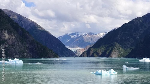 August 13, 2024 - Tracy Arm, USA - Scenic view of Tracy Arm Fjord in Alaska featuring glacier mountains water and several floating icebergs creating a picturesque landscape.