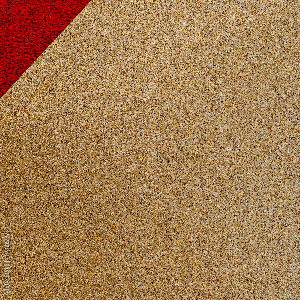 Fototapeta premium Colorful pattern of red and beige creating a modern design on a surface in a studio setting