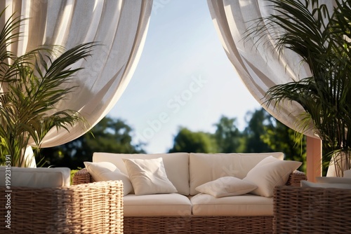 Comfortable Outdoor Seating Area With Plants and Flowing Curtains Near the Sea
