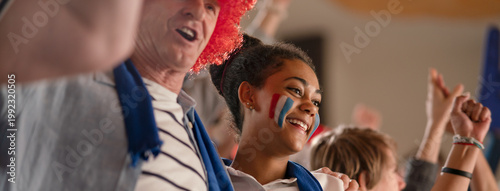 Canvas Print French football fans celebrating their team's victory at stadium.