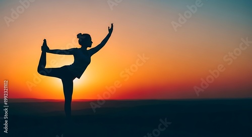 Silhouette of woman performing yoga dancer pose at sunset, inspiring balance and peace against a warm, vibrant sky.