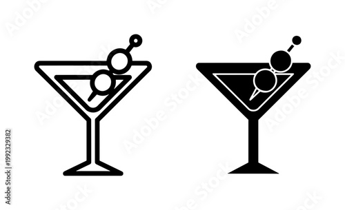 Martini glass icon with olives in outline and solid style