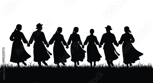 Lively group of people in folk costumes dancing together in a line while holding hands